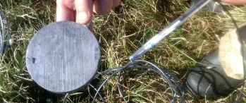 a person holding a metal object in their hand
