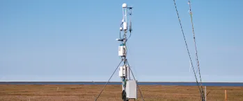 a weather station in the middle of a field
